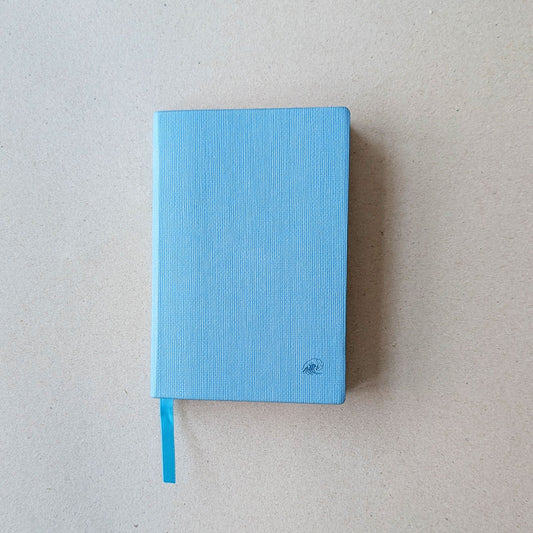 Blue notebook on a light gray background