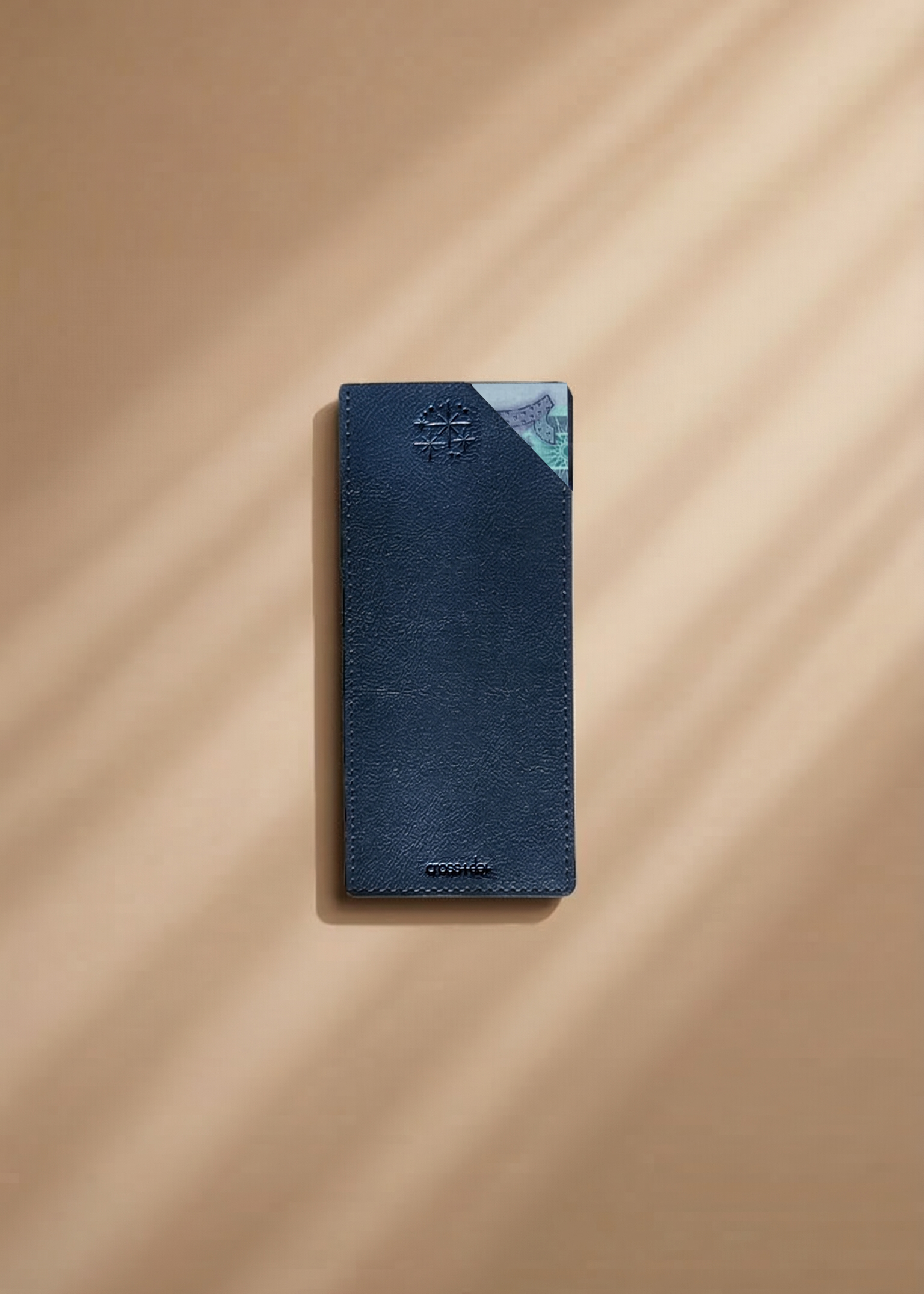 Navy leather money envelope with twinkle stars debossed  on a beige background